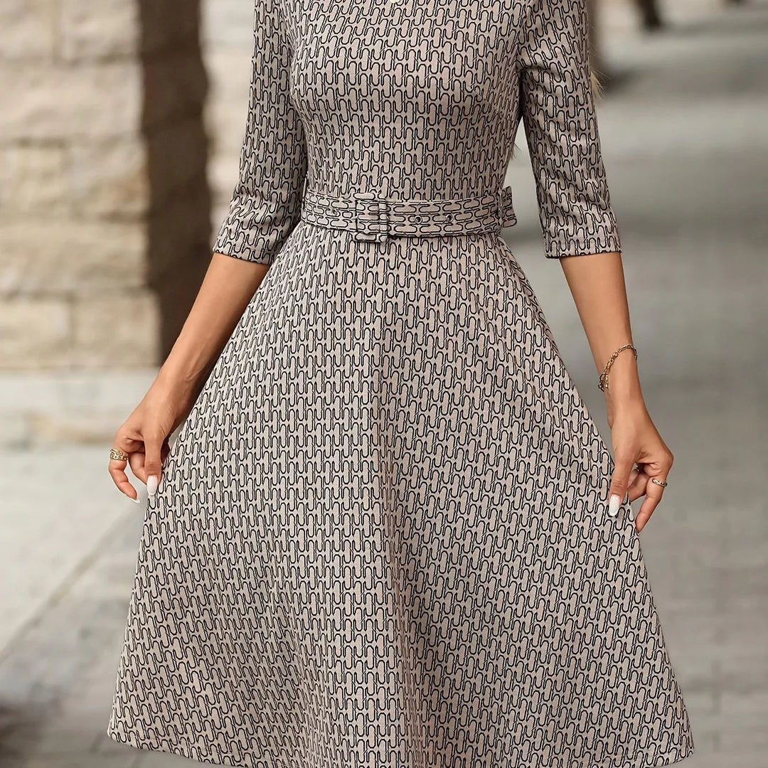 Dames jurk | Elegante midi jurk met ceintuur en print