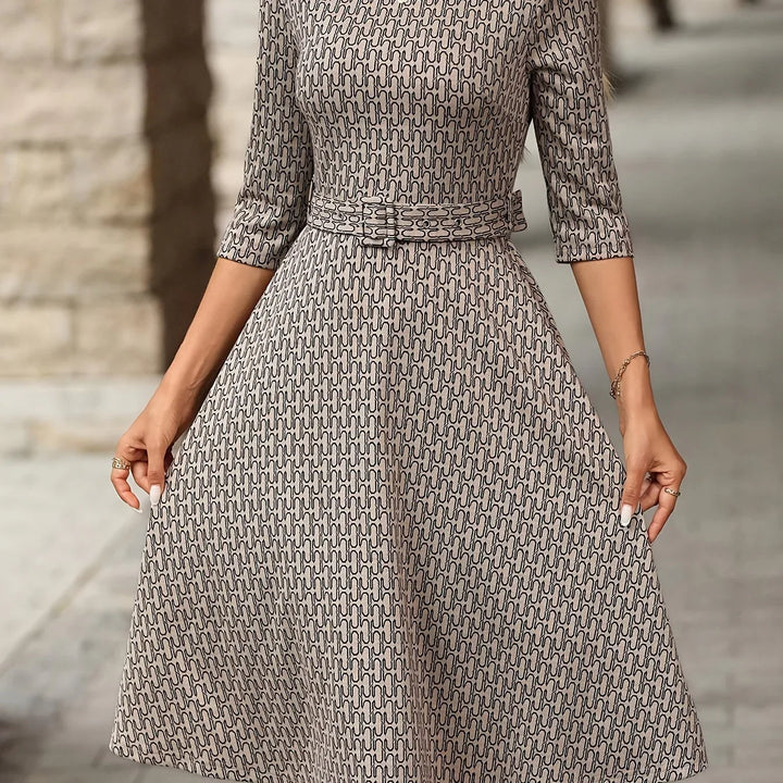 Dames jurk | Elegante midi jurk met ceintuur en print