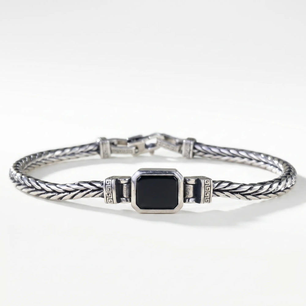 Armband heren | Stalen armband met zwarte steen en gevlochten design