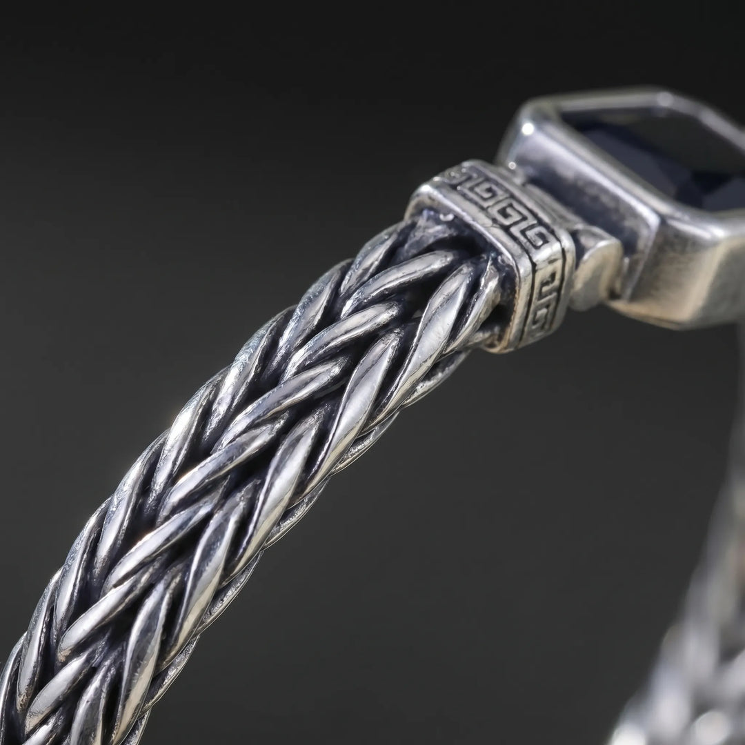 Armband heren | Stalen armband met zwarte steen en gevlochten design