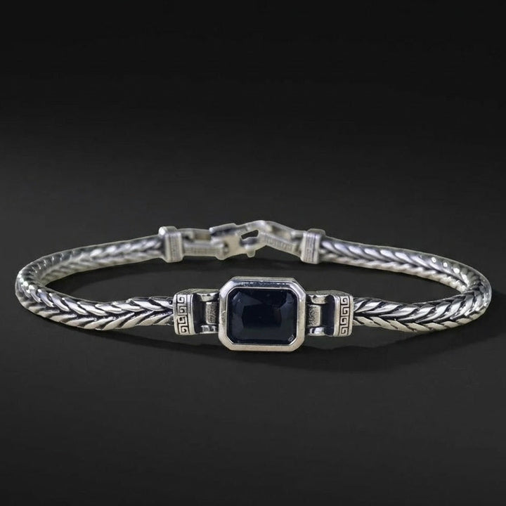Armband heren | Stalen armband met zwarte steen en gevlochten design