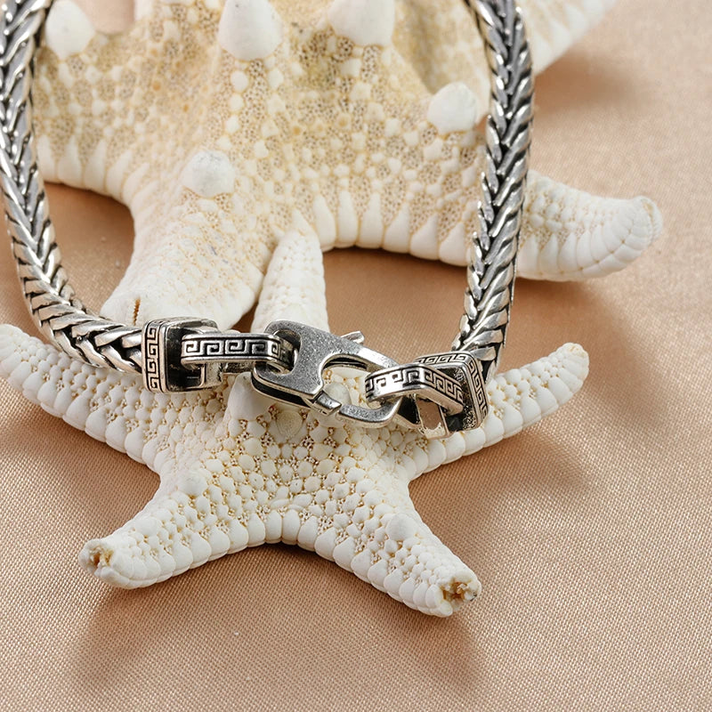Armband heren | Stalen armband met zwarte steen en gevlochten design