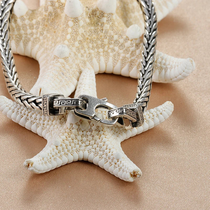 Armband heren | Stalen armband met zwarte steen en gevlochten design