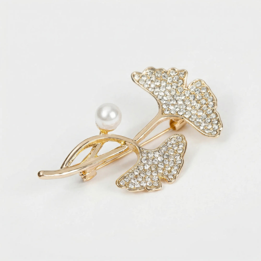 Broche dames | Goudkleurige broche met kristallen blaadjes