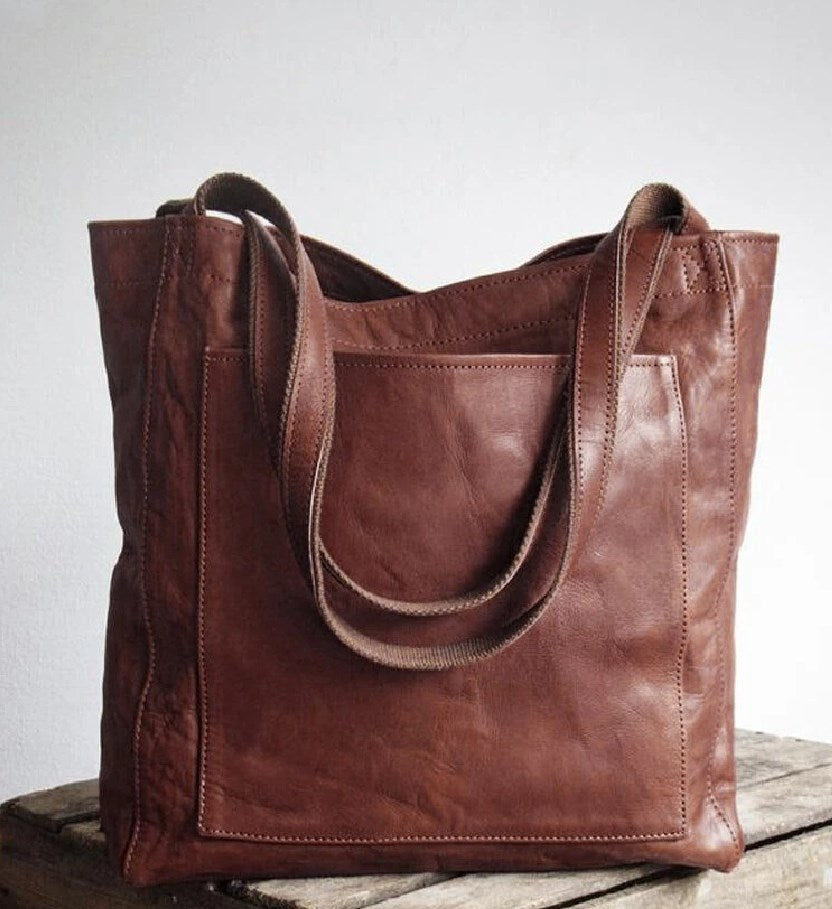 Damestas | Schoudertas van leerlook met ritsvakken