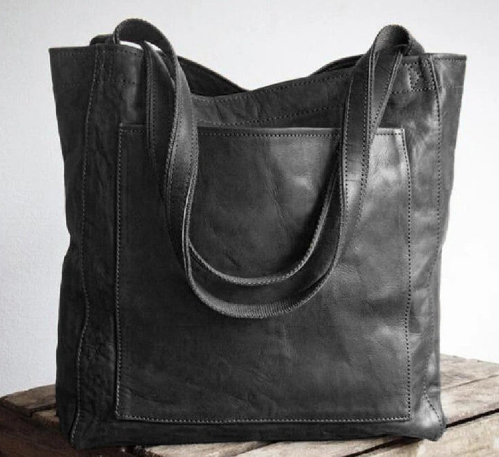 Damestas | Schoudertas van leerlook met ritsvakken