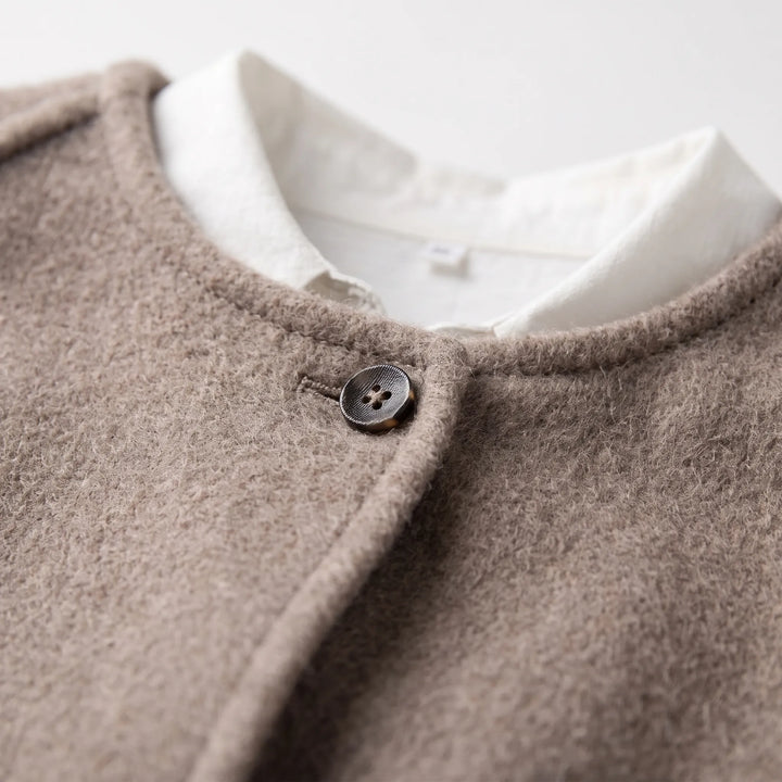 Tussenjas dames | Kort elegant model met knoopsluiting