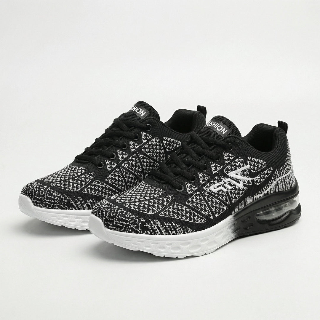 Zwarte sneakers dames | Sportief model met print en dempende zool