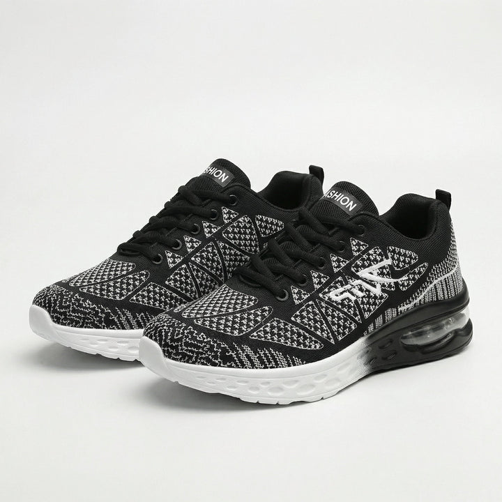 Zwarte sneakers dames | Sportief model met print en dempende zool