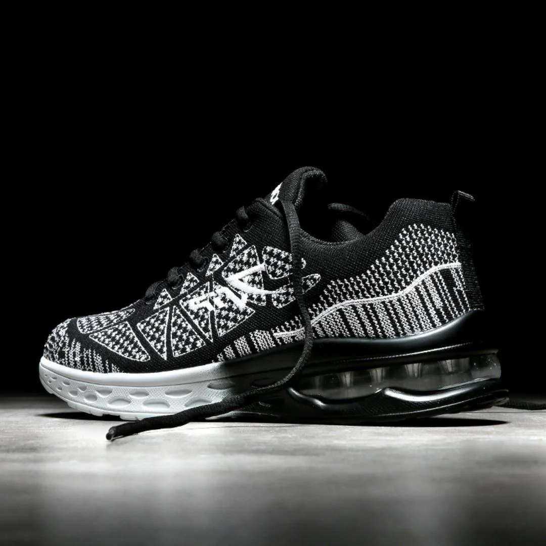 Zwarte sneakers dames | Sportief model met print en dempende zool